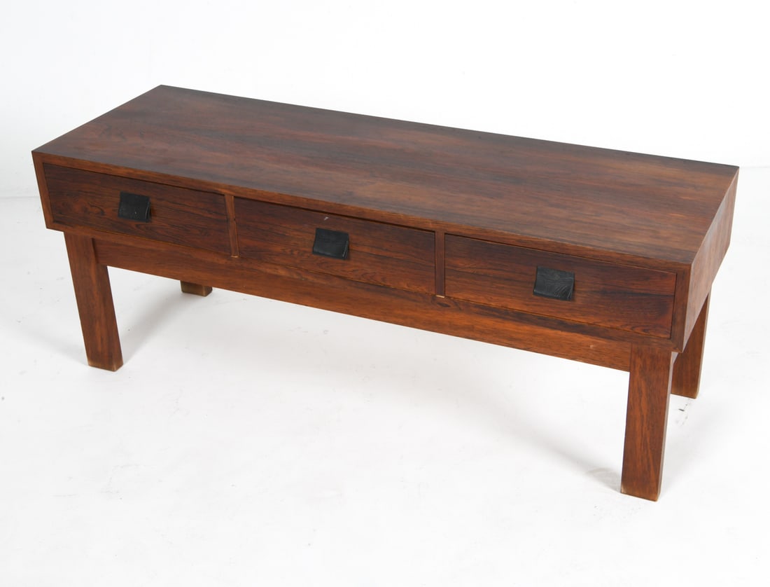 GLAS & TRA SWEDISH ROSEWOOD CONSOLE DRESSER: C. 1960's From Glas & Tra, tag inside drawer. Dimensions: H 17.5" x W 45.5" x D 15.5". Condition: Some sun fading on top. Scuffs and marks, Wear consistent with age and use. DMM011