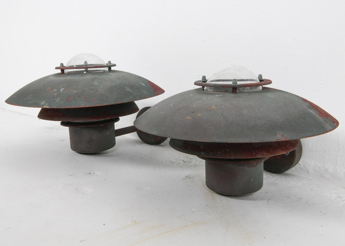 PAIR OF NORDLUX STEEL OUTDOOR SCONCES: Denmark, circa 1970's. Dimensions: H 9.5" x Dia. 12.5" x D 14". Condition: Wiring untested. Scuffs and minor losses to finish on shades, some oxidation. Wear consistent with age and outdoor use. DMM16