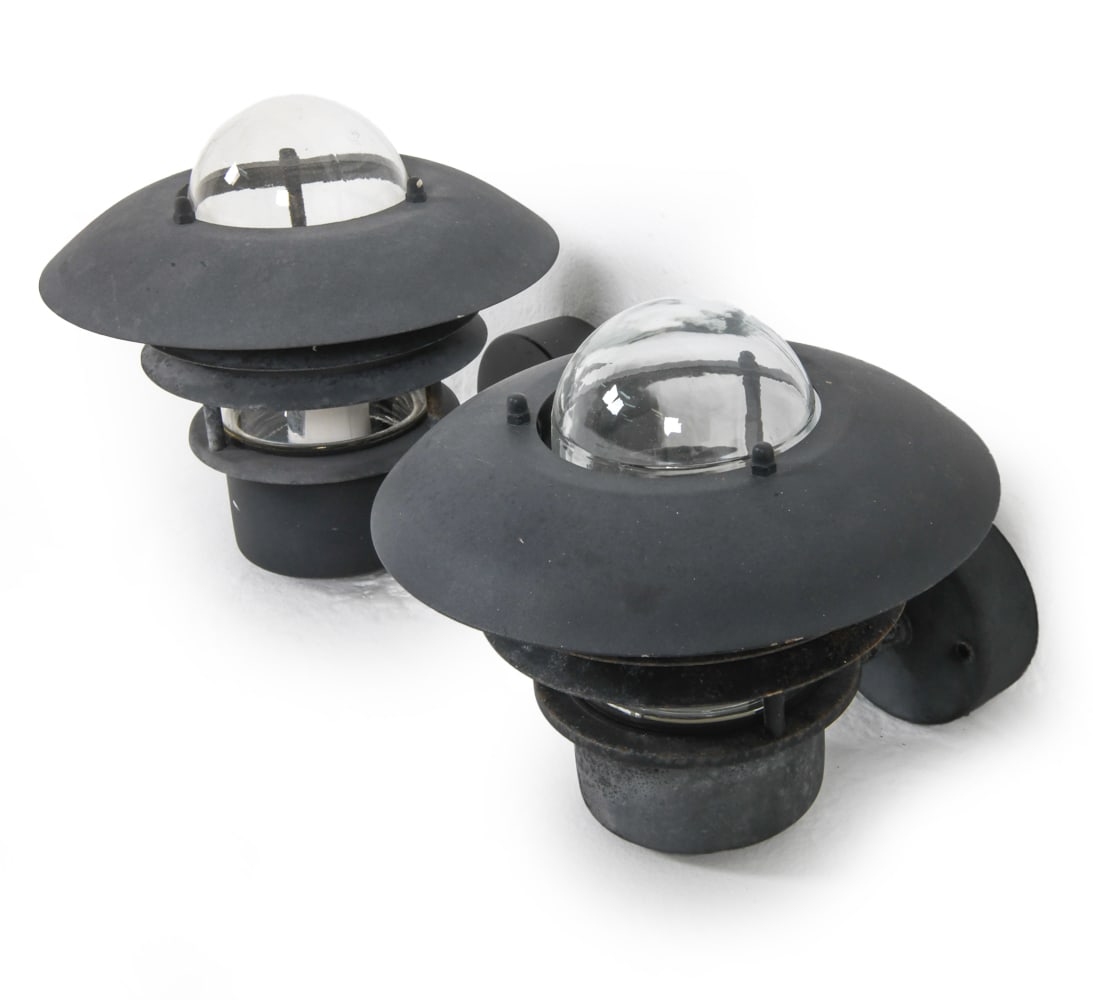 PAIR NORDLUX DANISH STEEL OUTDOOR SCONCES: Denmark, circa 1970's. Dimensions: H 8" x Dia. 9.5" x D 10". Condition: Wiring untested. Some scuffs and rubs to finish. Wear consistent with age and outdoor use. DMM186