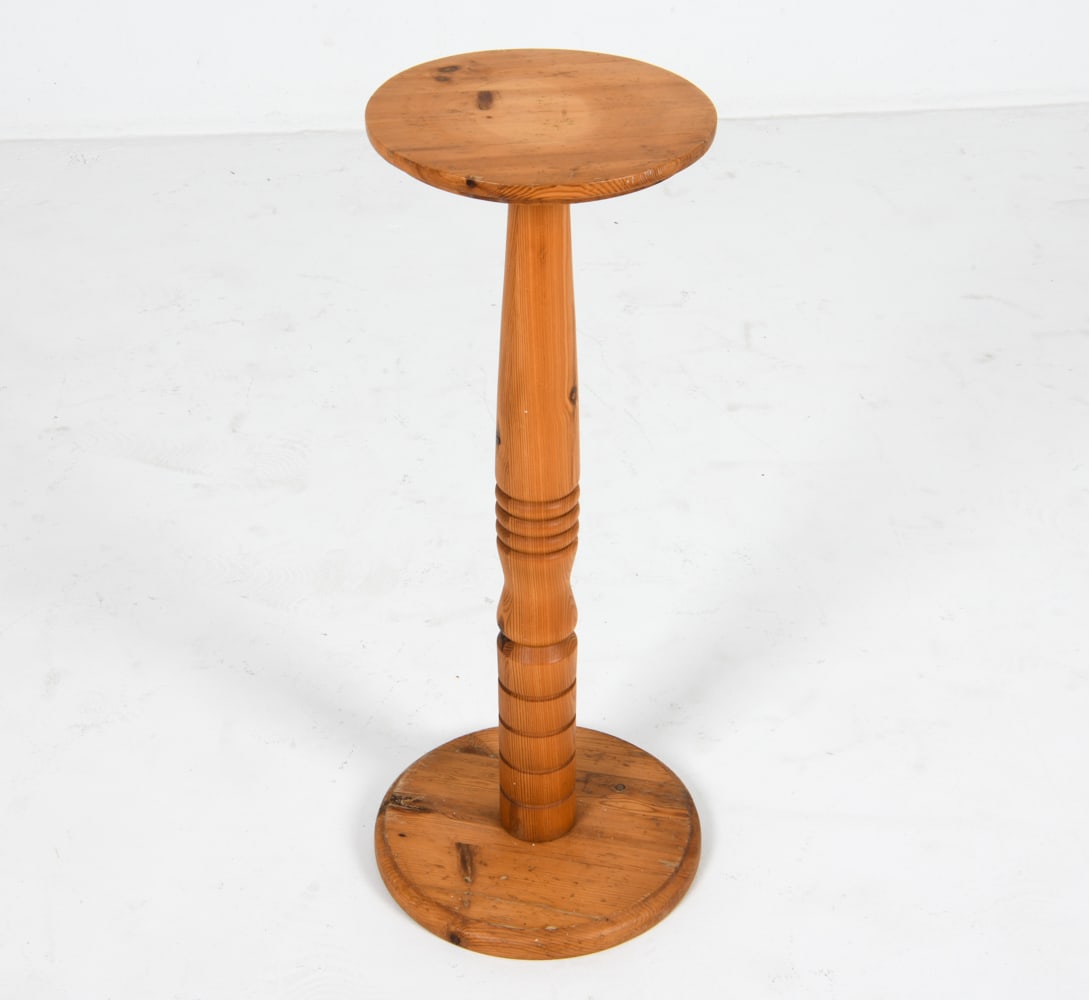 SWEDISH PINE PEDESTAL STAND C. 1970'S: Dimensions: H 26.5" x Dia. 10". Condition: Scuffs and scratches, sun fading on top. Wear consistent with age and use. DMM194