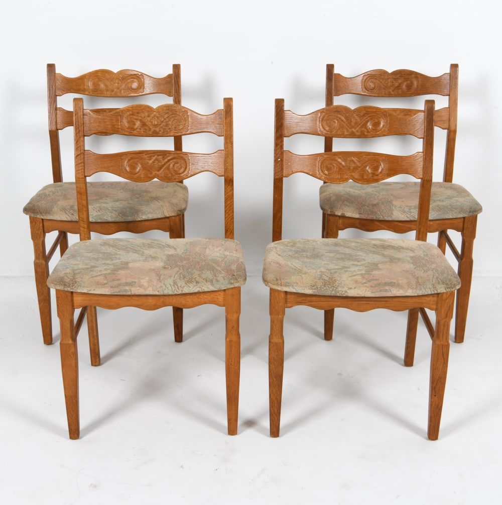 (4) HENRY KJAERNULF DANISH OAK DINING CHAIRS: For EG. Fabric upholstered seats. Tags underneath. Denmark, circa 1970's. Dimensions: H 32" x W 17.25" x D 15.75" x SH 17.25". Condition: Few small dings and scuffs to wood. Could use reupholstery. We
