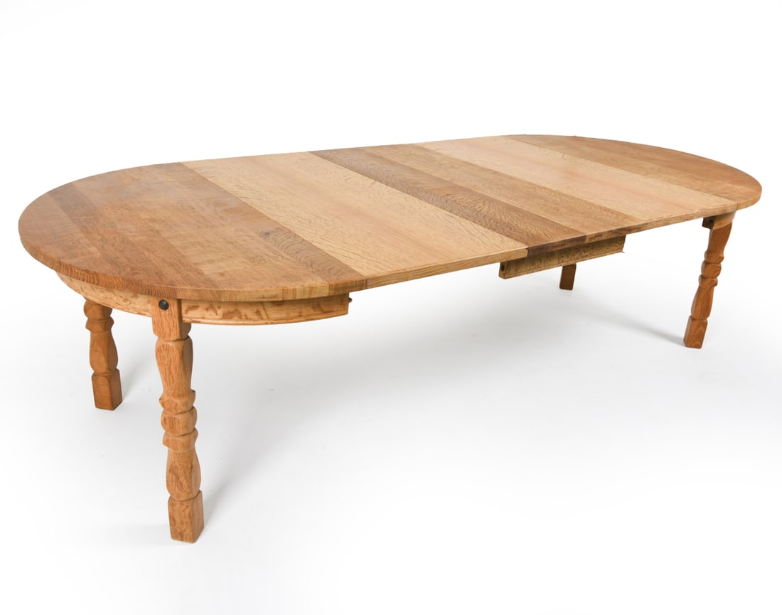 KJAERNULF STYLE DANISH OAK EXTENDING DINING TABLE: With 3 leaves. Danish. Circa 1970's Dimensions: H 29" x Dia 47" (leaves) w 19.75" Condition: Slight marks and scuffs on surface. Rubbing to Edges. Wear consistent with age and use. B032