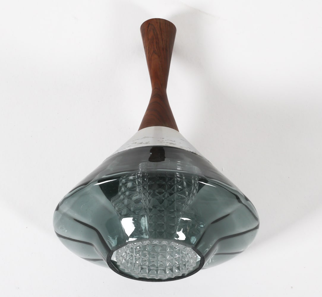 HANS-AGNE JAKOBSSON GLASS & ROSEWOOD PENDANT LIGHT: Denmark, circa 1970's. Dimensions: H 14.5" x Dia. 9.5". Condition: no wire included, needs wiring. Scuffs and scratches to steel accent. Wear consistent with age and use. B099