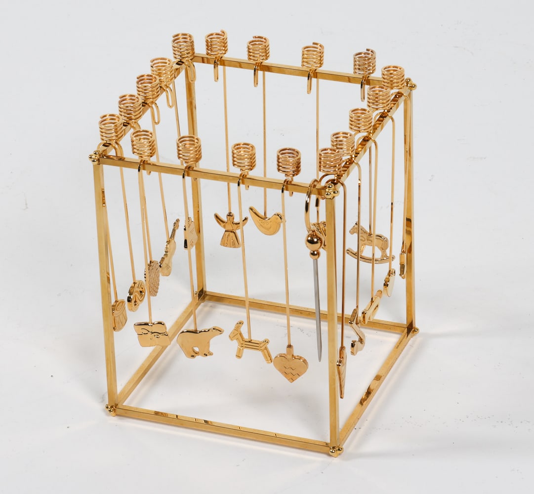 GEORG JENSEN GOLDEN CHRISTMAS CANDLE HOLDER: Designed by Andreas Mikkelsen. Gold-plated brass. In original box with velvet wrappings. Denmark, circa 1970's. Dimensions: Frame H 8" x W 6.75" x D 6.75". Holder H 7". Condition: Few light scuffs and