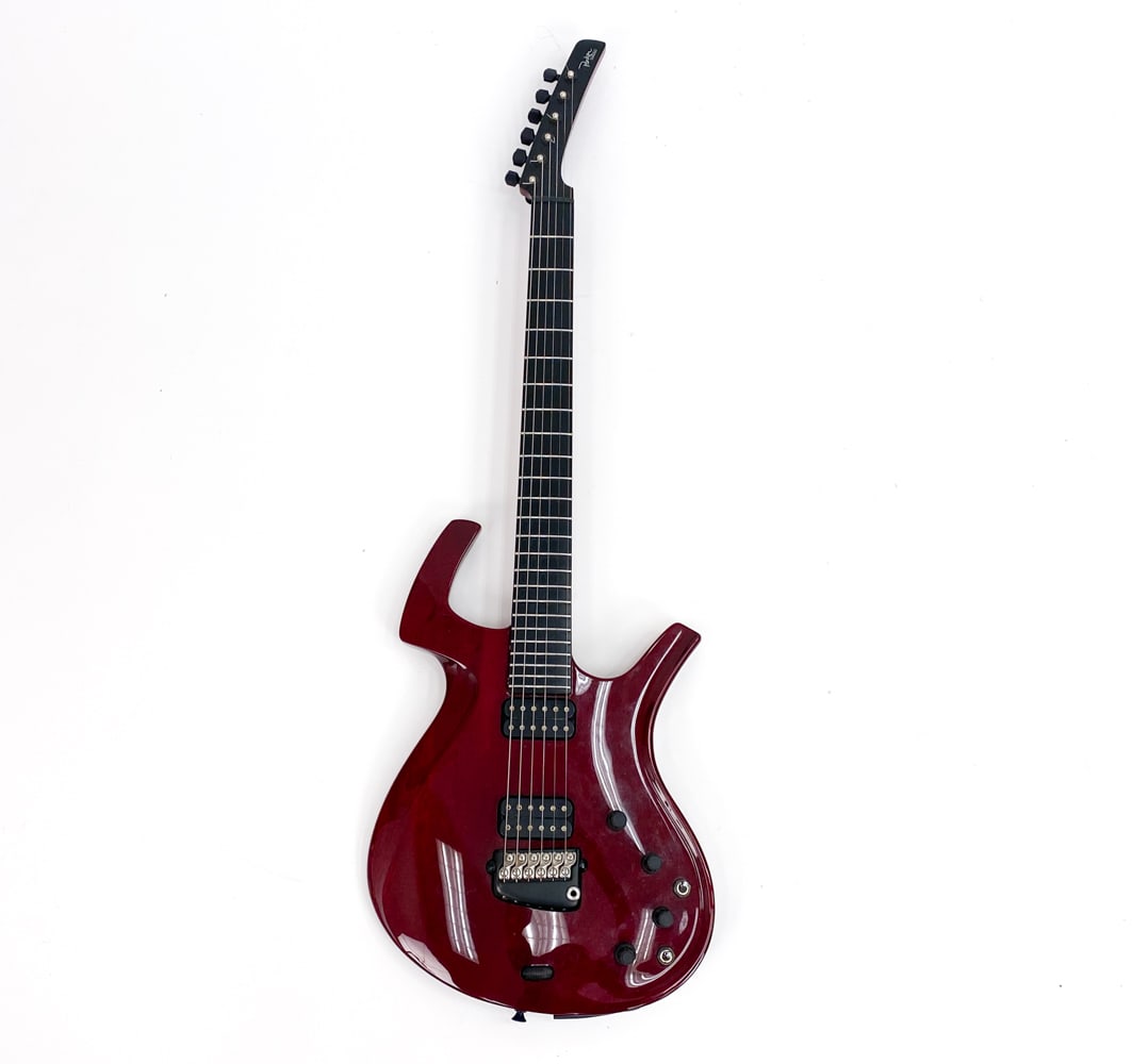 PARKER FLY USA RED ELECTRIC GUITAR: #022059BMH USA, c. 1993-2016. Double cutaway body with carbon fiber fretboard and black/chrome hardware. Locking tuners. Includes (2) whammy bars. Condition: Like-new. Visible marks on fingerboard fro