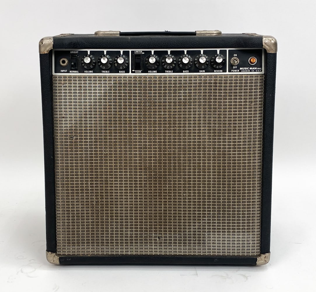 MUSICMAN 112 RD FIFTY 50-WATT GUITAR COMBO AMP: U.S. made. Hybrid amp. WGS ET65 8 Ohm 12" Speaker. 40-99 wattage range. Power cable included. Condition: Fair condition. Tested. Knobs, input jacks and other features are working. Showing exterior wea
