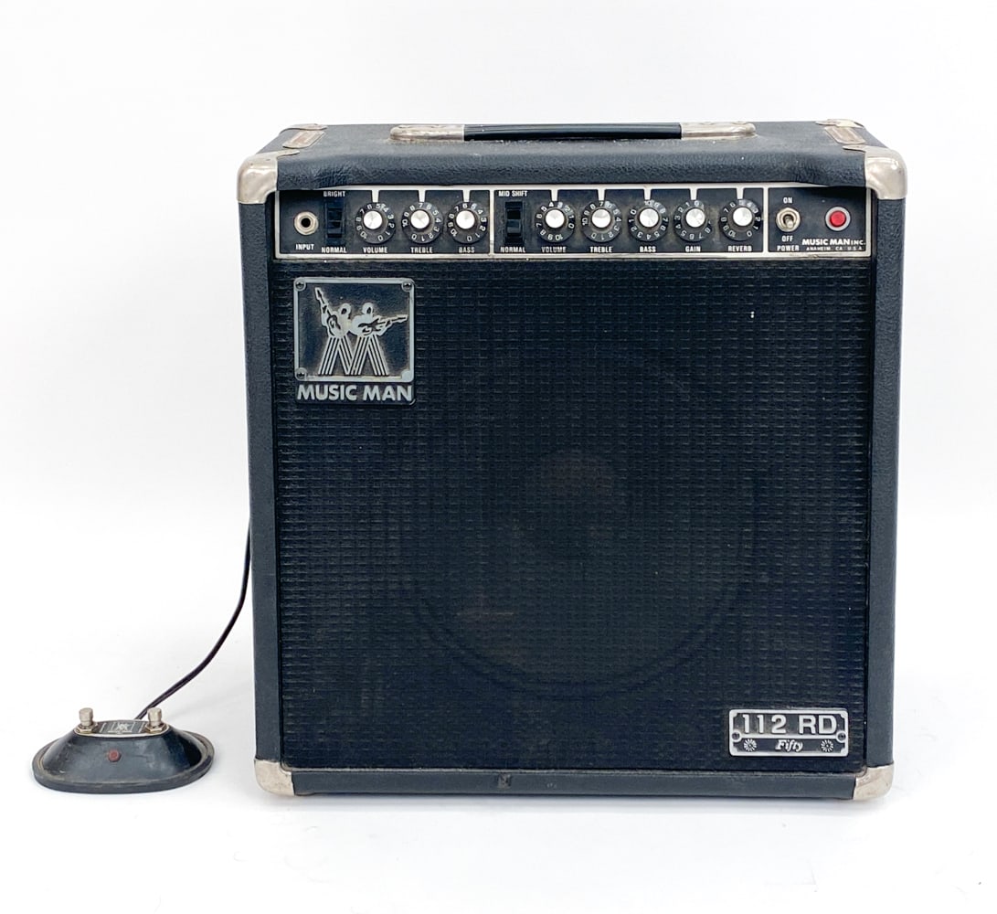 MUSIC MAN 112RD 50 WATT GUITAR COMBO AMPLIFIER: 50 watts from a pair of Fender USA labeled 6L6 power tubes with clean tone. Power cable included. Includes foot switch. Condition: Tested, in working condition.