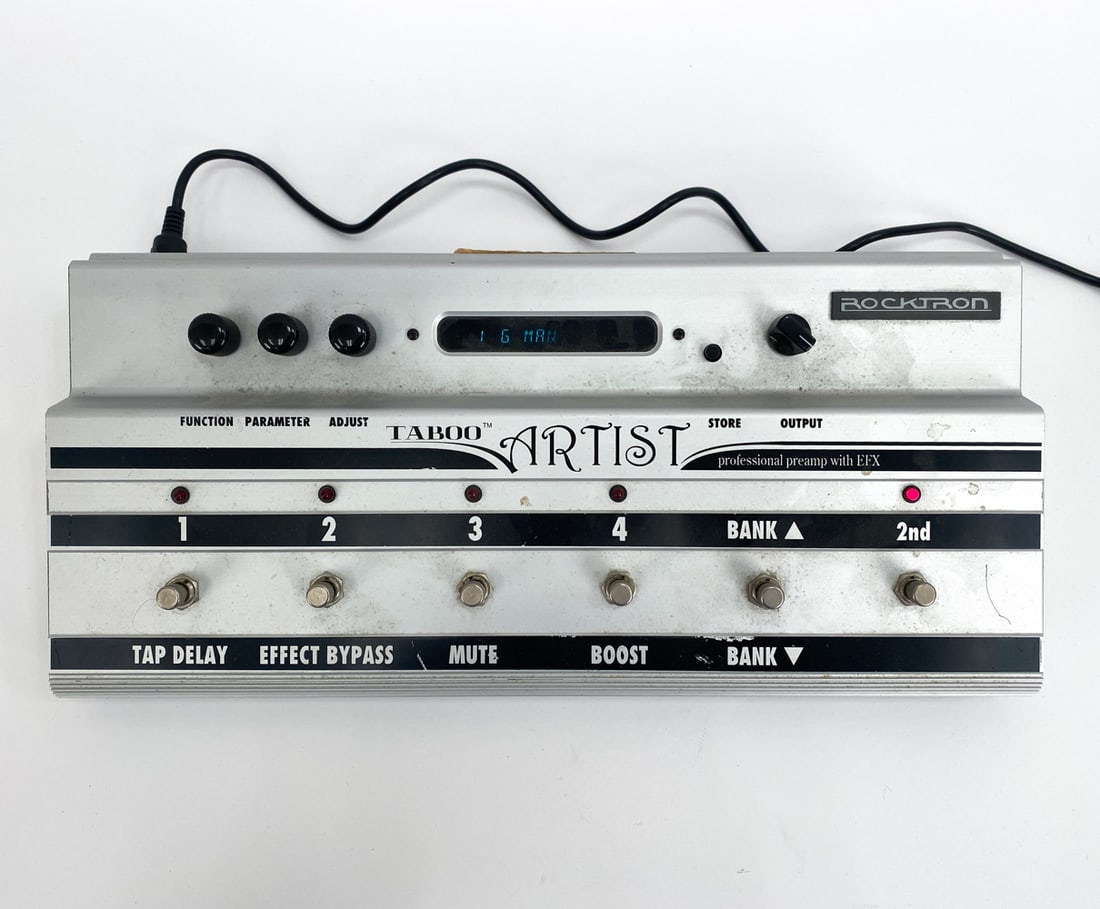 ROCKTRON TABOO ARTIST PROFESSIONAL PREAMP W/EFX: The Artist is a complete 24-bit DSP professional guitar preamp and footswitching system, providing 12 unparalleled effect algorithms and superb sound quality. Power cable included. Condition: Plugged 