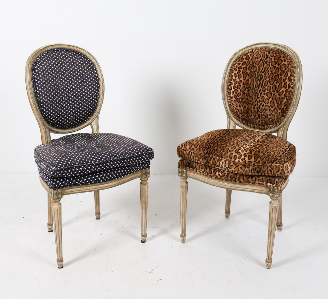 LOUIS XVI STYLE BALOON BACK SIDE CHAIRS: cocktail chairs with carved and painted wood, fabric upholstery, and balloon backs. Linen covers are included. Dimensions: H 38.5" x W 21.5" x D 16.5" x SH 20.5". Condition: Fading to fabric upholster