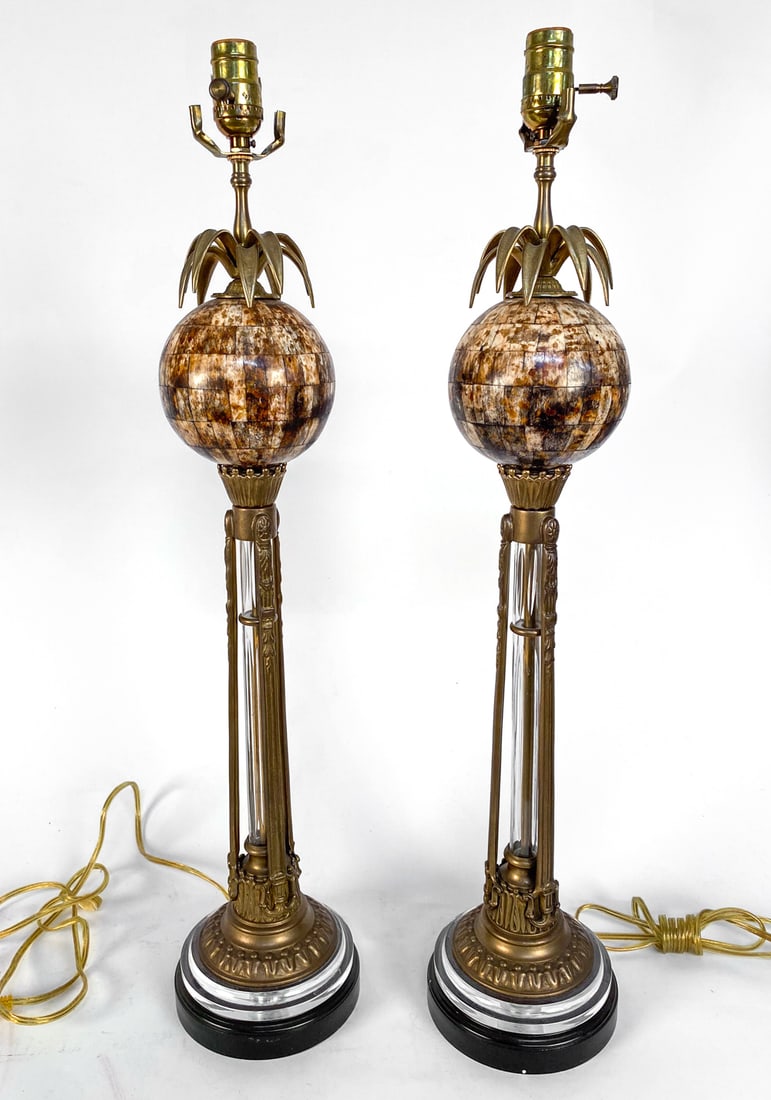 PAIR OF REGENCY STYLE BRASS & GLASS TABLE LAMPS: Contemporary, Glass and brass center posts in column designs. Tessellated bone orb tops with brass palm leaves. Dimensions: H 30.25" x Dia. 6.5". Condition: Minor scuffs and marks on metal and glass. 