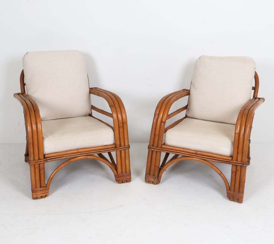 PAIR OF BAMBOO & RATTAN LOUNGE CHAIRS: Mid 20th century. Dimensions: H 30" x W 26.5" x D 28.5" x SH 16". Condition: Some scuffs, dings, rubs to bamboo. Some fading to cushions. Wear consistent with age and use.