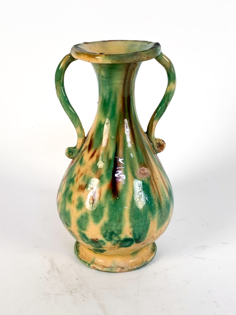 ANTIQUE FRENCH POTTERY HANDLED VASE: Dimensions: H 8.5" x W 4.75" x D 4.75" Condition: Moderate nicks and cracks to glazing. Loss to glaze. Wear consistent with age and use.