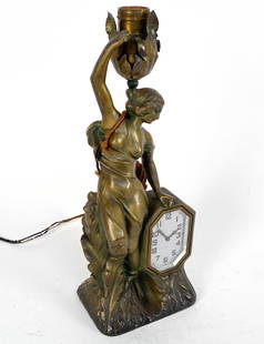 INGRAHAM ART NOUVEAU TABLE CLOCK: Marked on clock face and backside The E. Ingraham Company. Circa late 19th Century. Dimensions: H 13.5" x W 5.25" x D 3.75" Condition: Slight blemishes and tarnishing to brass. Rubbing to gold tone ex
