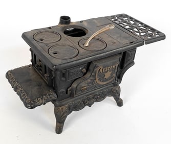 ANTIQUE CRESCENT CAST IRON TOY STOVE