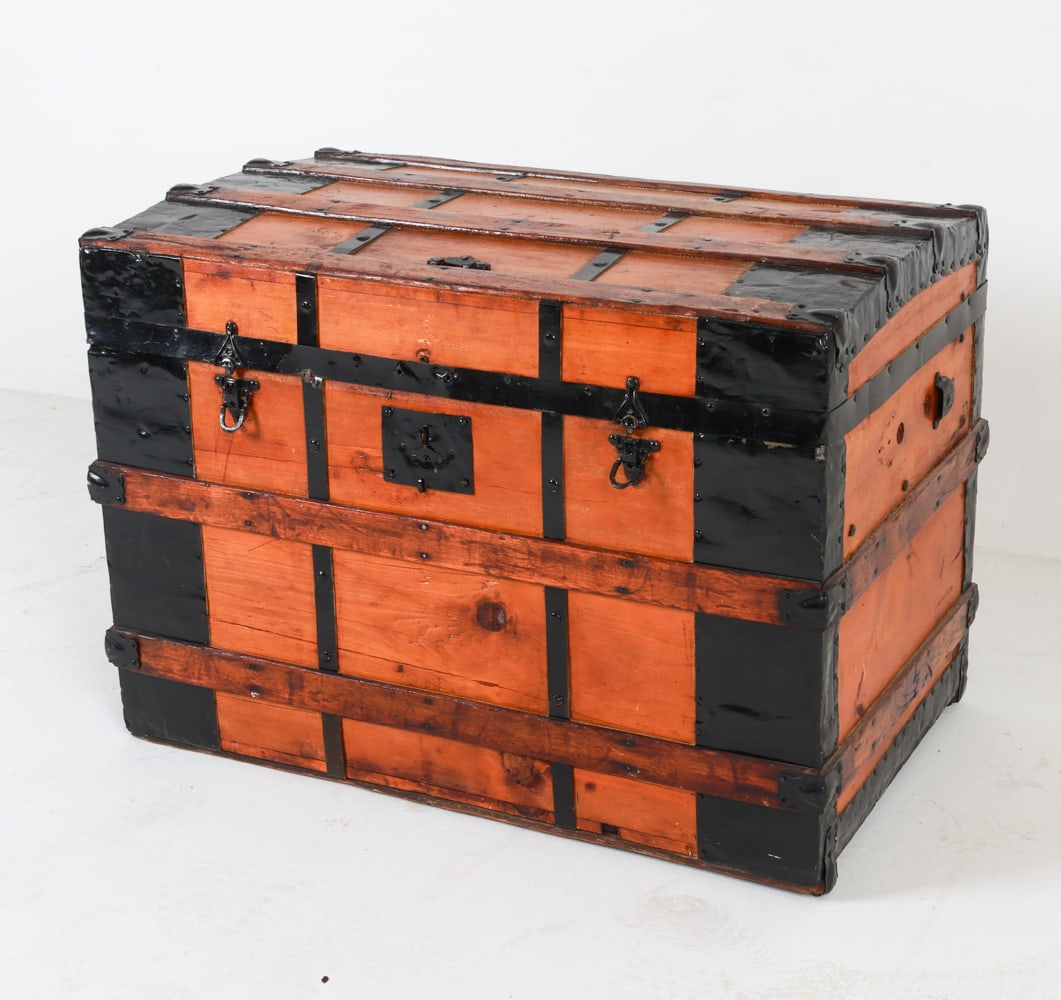 ANTIQUE STEAMER TRUNK: Appears to be refinished. Dimensions: H 23" x W 32" x D 20". Condition: Indenting on metal exterior. Missing side handles. Moderate scuffs, blemishes and scratches. Wear consistent with age and use.