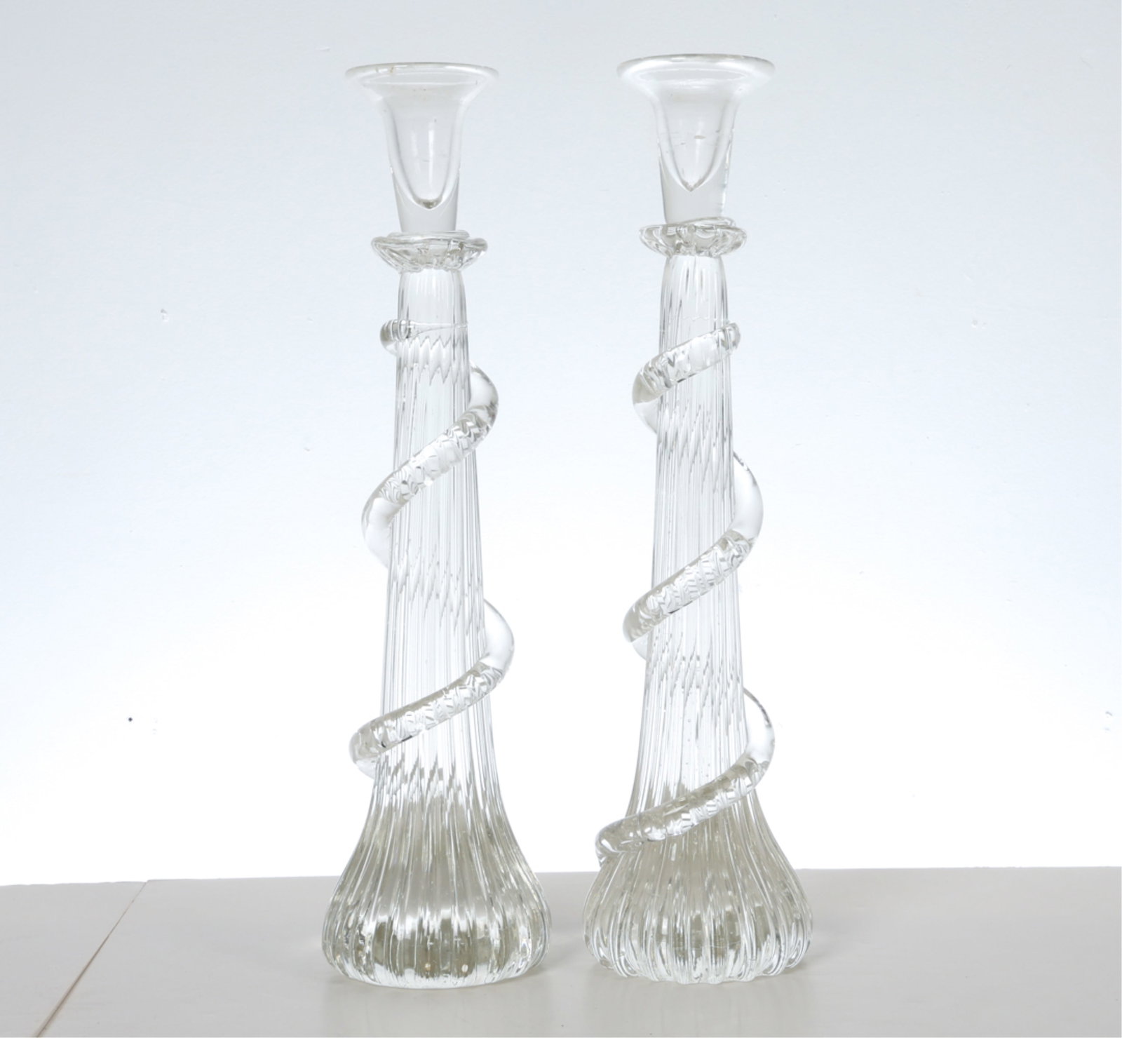 HAND BLOWN GLASS COLUMN CANDLE STICKS: Column forms with spiral designs. Dimensions: H 16.75" x Dia 4.25" Condition: Slight marks to glass. Wear consistent with age and use.