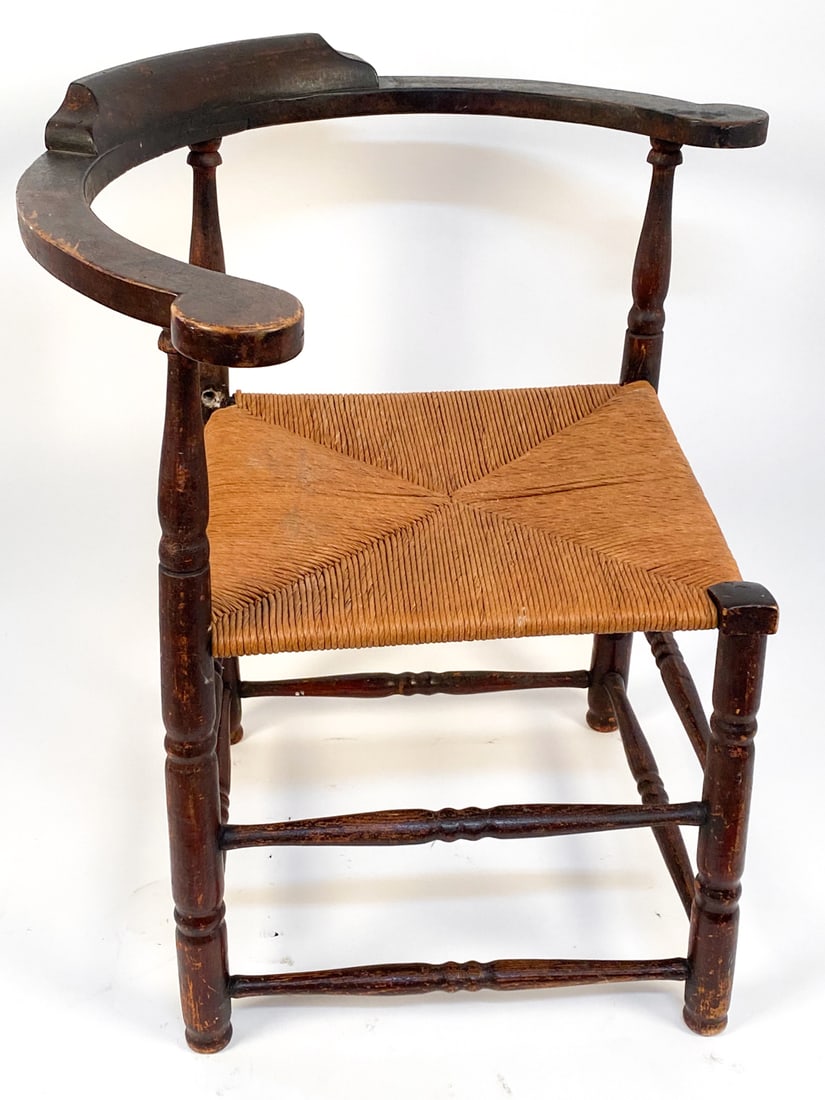 ANTIQUE OAK & RUSH CORNER CHAIR: Dimensions: H 29" x W 28" x D 25" Seat height: 17" Condition: Moderate scuffs and rubbing to paint. Slight discoloration to rush seat. Seat is slightly unwoven to back corner. Wear consistent with age