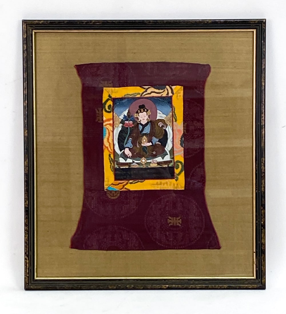 INDIAN MINIATURE PAINTING: Embroidered fabric with a depiction of Buddha in center. With inscription on lower center. Dimensions: (Frame) H 22.5" x W 20" (Fabric) H 15.5" x W 12.5" Condition: Couple loose threads. Frame with ru