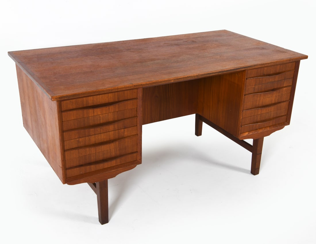 DANISH TEAK DESK C. 1960S: Dimensions: H 28.75" x W 56.75" x D 29". Condition: Missing shelf to one cabinet. Shallow gouge to one edge on side. Faint scuffs and scratches to top. Wear consistent with age and use. DMN143