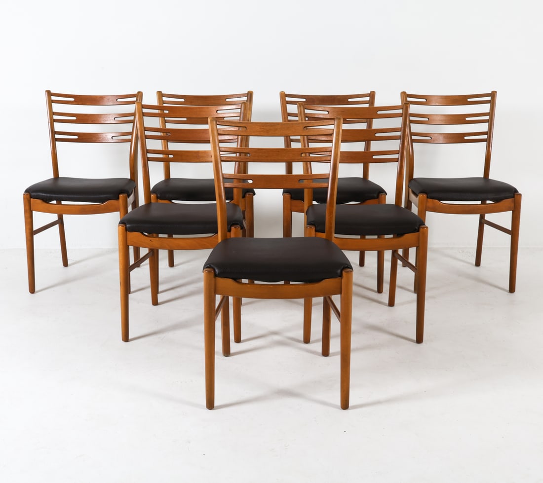 (7) FARSTRUP DANISH TEAK DINING CHAIRS: Leather upholstered seats. Denmark, circa 1960's. Dimensions: H 33.5" x W 17.5" x D 17" x SH 18". Condition: Few scuffs and scratches to wood. Some discoloration or water marks to few legs. Wear consi