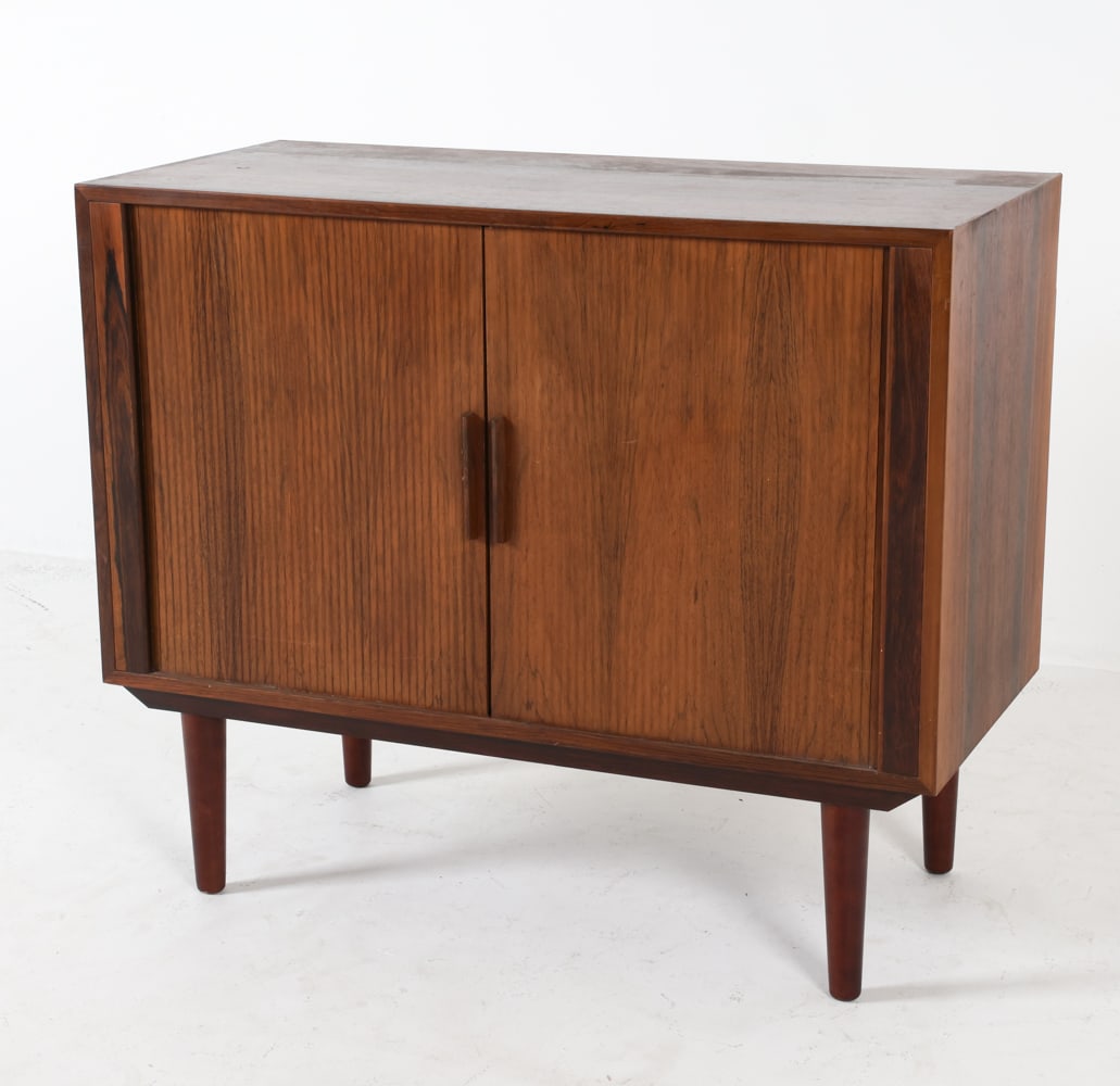 KAI KRISTIANSEN DANISH ROSEWOOD TAMBOUR CABINET: Features tambour doors with interior drawers. Dimensions: H 28.5" x W33.75" x D 13.75" Condition: Edges of cabinet show scattered nicks and scuffs. Wear consistent with age and use. DMN147