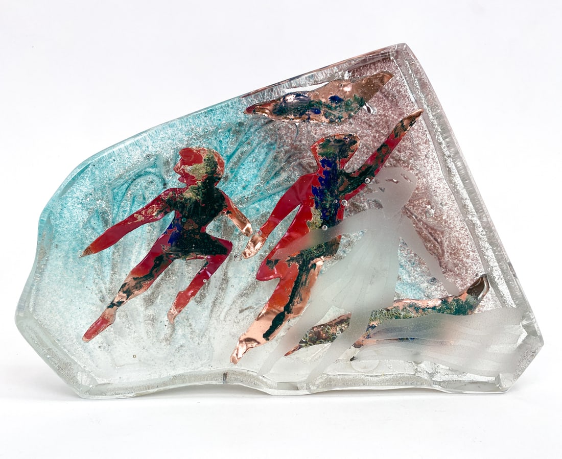PAMELA STADUS (B.1953) STUDIO ART GLASS SCULPTURE: Signature to side edge. Sand cast and copper encased in clear glass, with an etching of a figure to the front. Dimensions: H 7.75" x W 11" X D 1.75" Condition: Minor surface soiling Presents well over