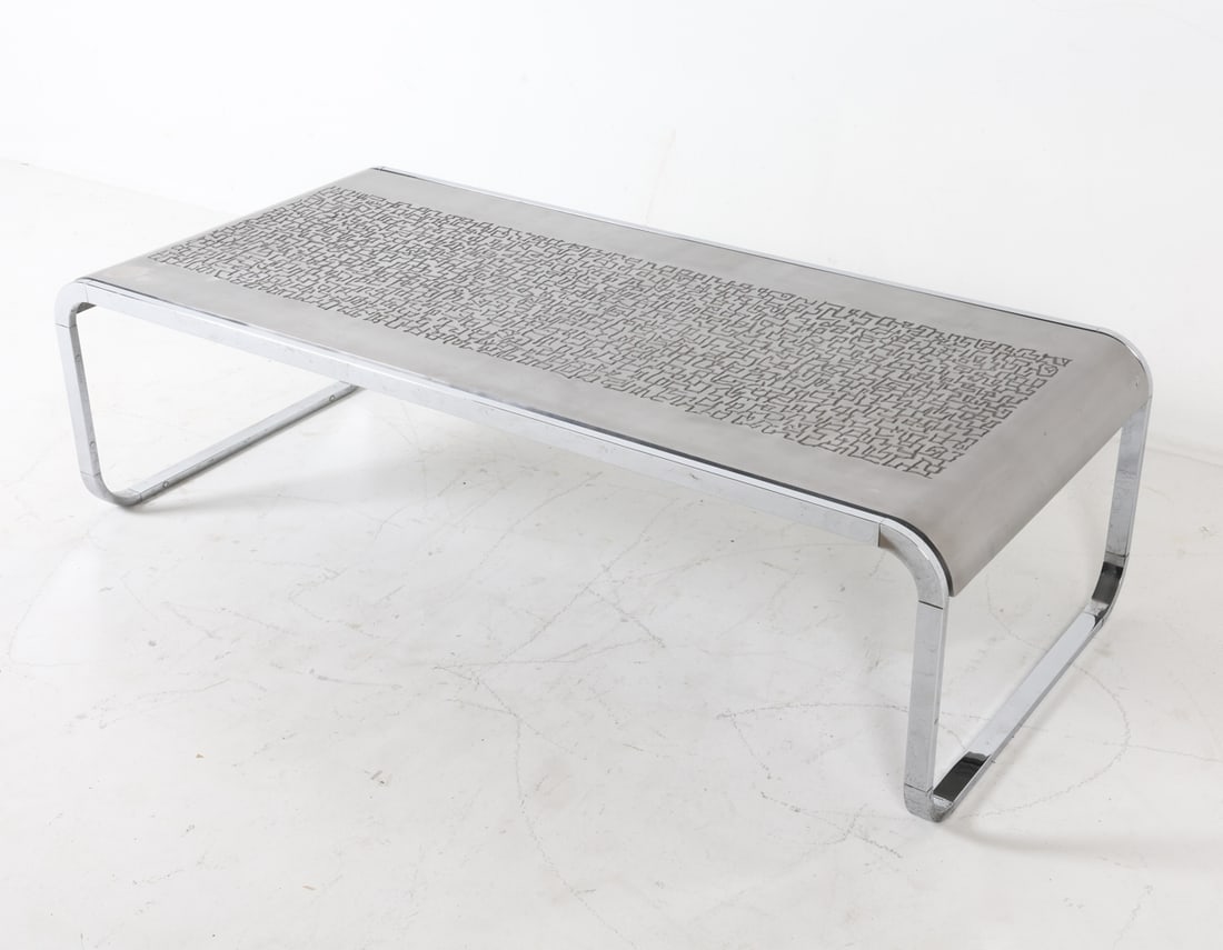 HEINZ LILIENTHAL STEEL & ALUMINUM COFFEE TABLE: Steel frame with graphic patterns and an etched aluminum top. Dimensions: H 15.5" x W 55.5" x D 25". Condition: The frame shows slight marks and scuffs, while the etched aluminum top has scattered ble