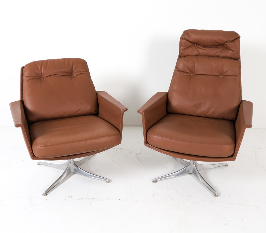 HORST BRUNING FOR COR HIS & HERS SWIVEL CHAIRS: 1960's Light brown leather his and her chairs with chrome swivel bases Dimensions: (Largest chair) H 35.25" x W 28.5" x D 26.5", SH 17" Condition: Both chairs show moderate scratches and marks on the