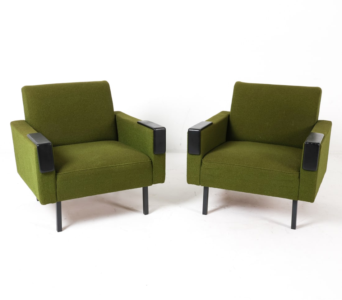 PAIR OF DUTCH LOUNGE CHAIRS C. 1960S: Features wool upholstery complemented by leather-capped armrests and metal post legs. Dimensions: H 27.5" x W 30" x D 29", SH 15" Condition: The upholstery shows moderate scuffs and some losses. Prese