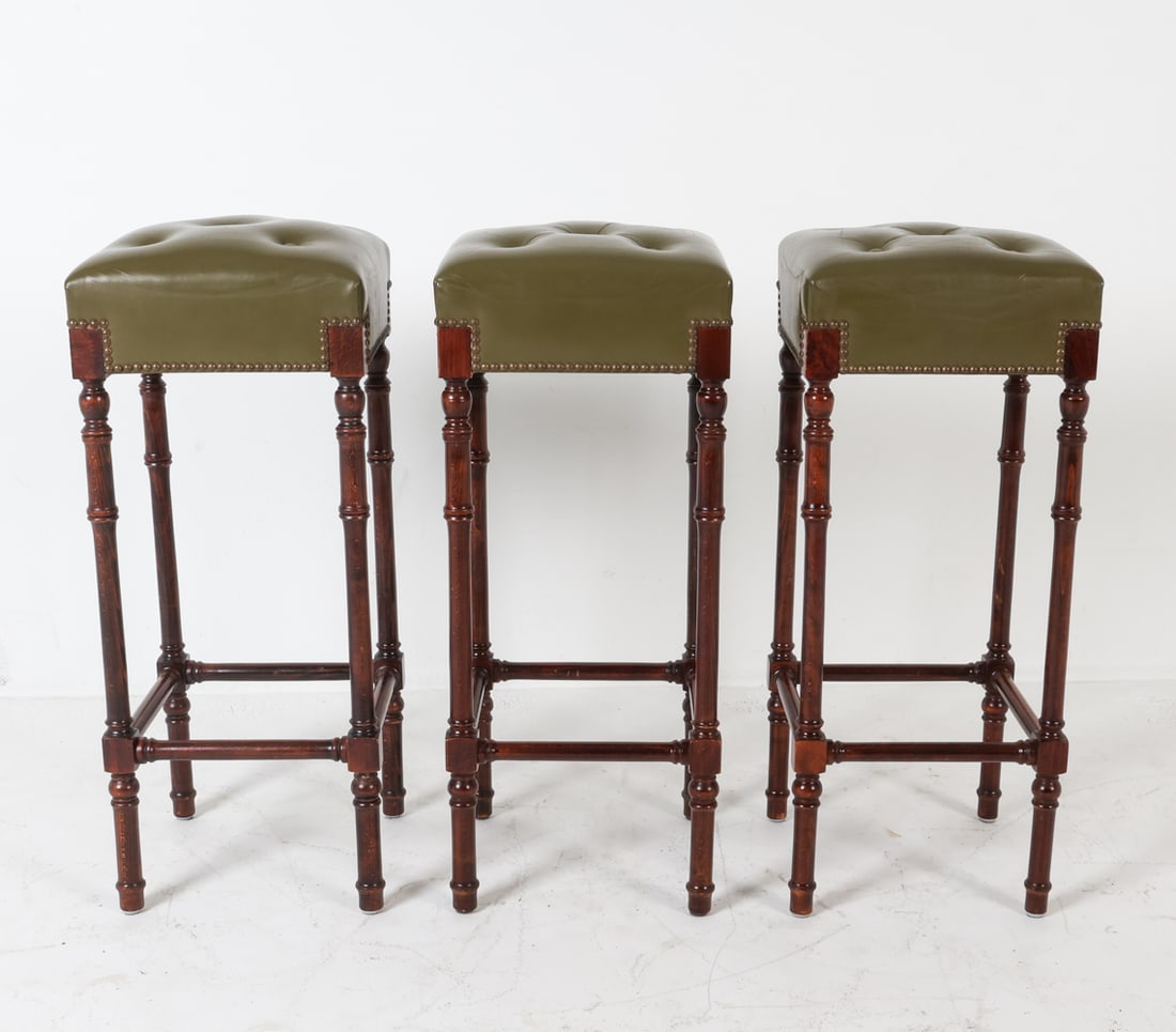 (3) CHESTERFIELD STYLE LEATHER & BEECH BARSTOOLS: Classic Chesterfield tufting on green leather seats. Dimensions: H 32.5" x W 13.5" x D 13.5". Condition: Few light scuffs to leather. Wear consistent with age and use. PL070