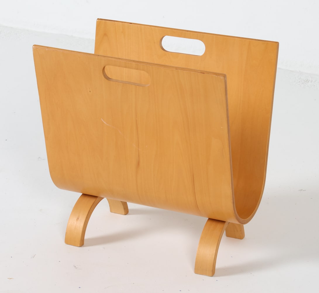 ALVAR AALTO STYLE BIRCH MAGAZINE RACK C. 1960'S: Crafted from birch, this magazine rack features elegant bentwood construction with cut-out handles at the top for convenient carrying. Dimensions: H 16.5" x W 16" x D 10". Condition: Minor wear includ