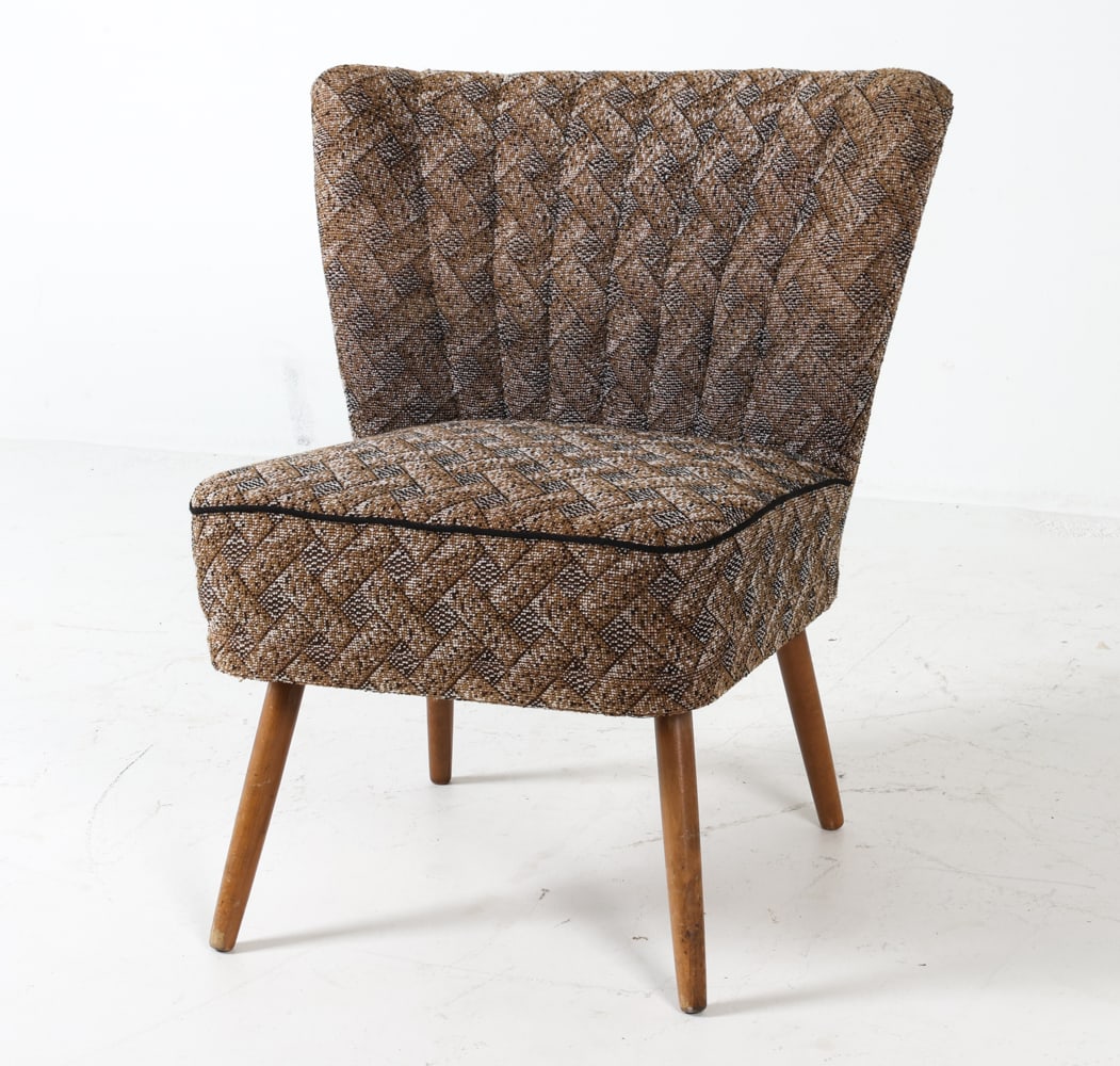 SCANDINAVIAN WOOL COCKTAIL CHAIR C. 1950S: Upholstered in patterned wool fabric with tapered legs, this compact Scandinavian cocktail chair offers a stylish seating option. Its modest size ensures versatility for various living spaces. Dimensi