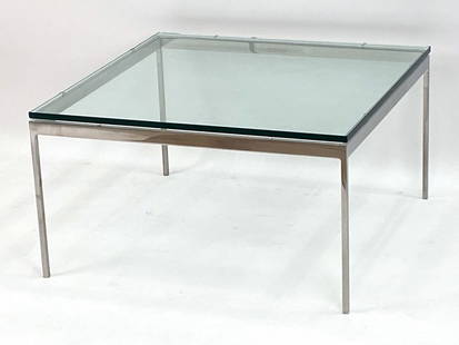 ATTR. NICOS ZOGRAPHOS 35 SERIES COCKTAIL TABLE: United States, circa 1970's. Stainless steel frame with a glass top. Remnants of a label on underside of frame. Dimensions: H 19" x W 35" x D 35" Condition: Minor scratches, a couple of flea bites to