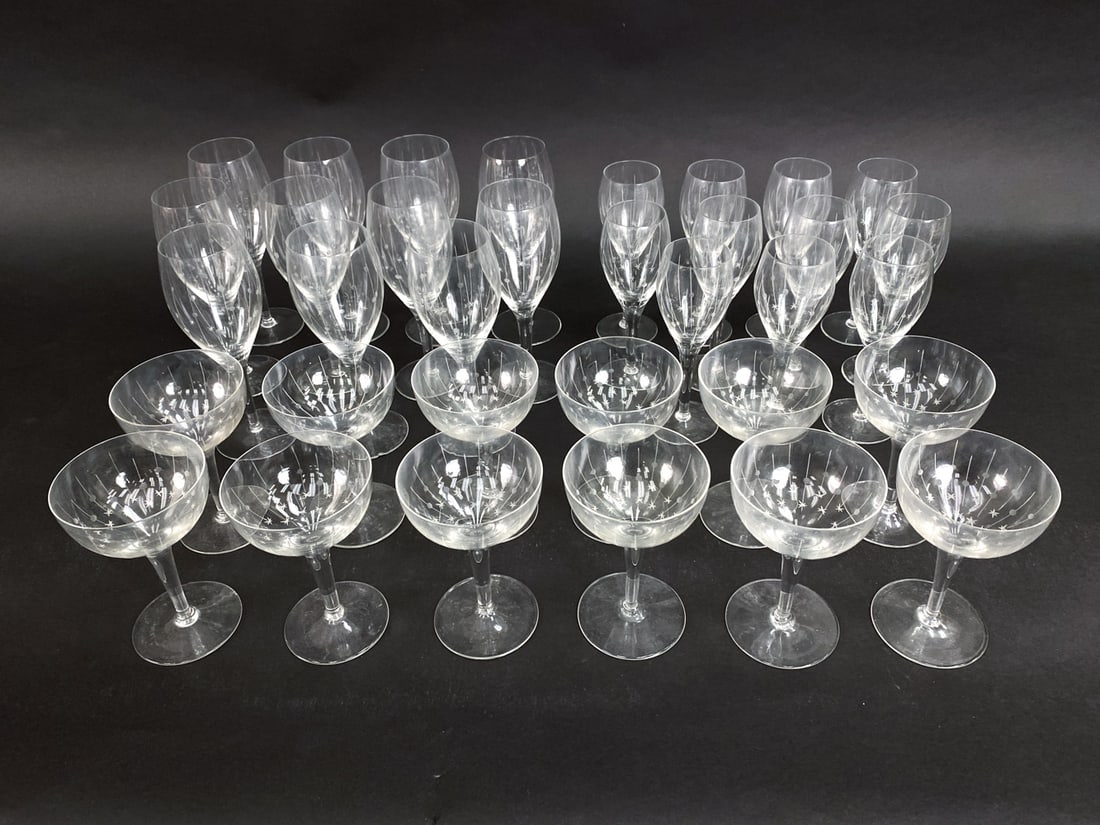 MID-CENTURY ETCHED GLASS STEMWARE: With vintage etched stemware including 11 wine glasses, 11 martini glasses, 11 sherry glasses. Dimensions: (Wine glasses) H 8.25" x Dia 2.75" Condition: Slight scuffs and marks. Wear consistent with a
