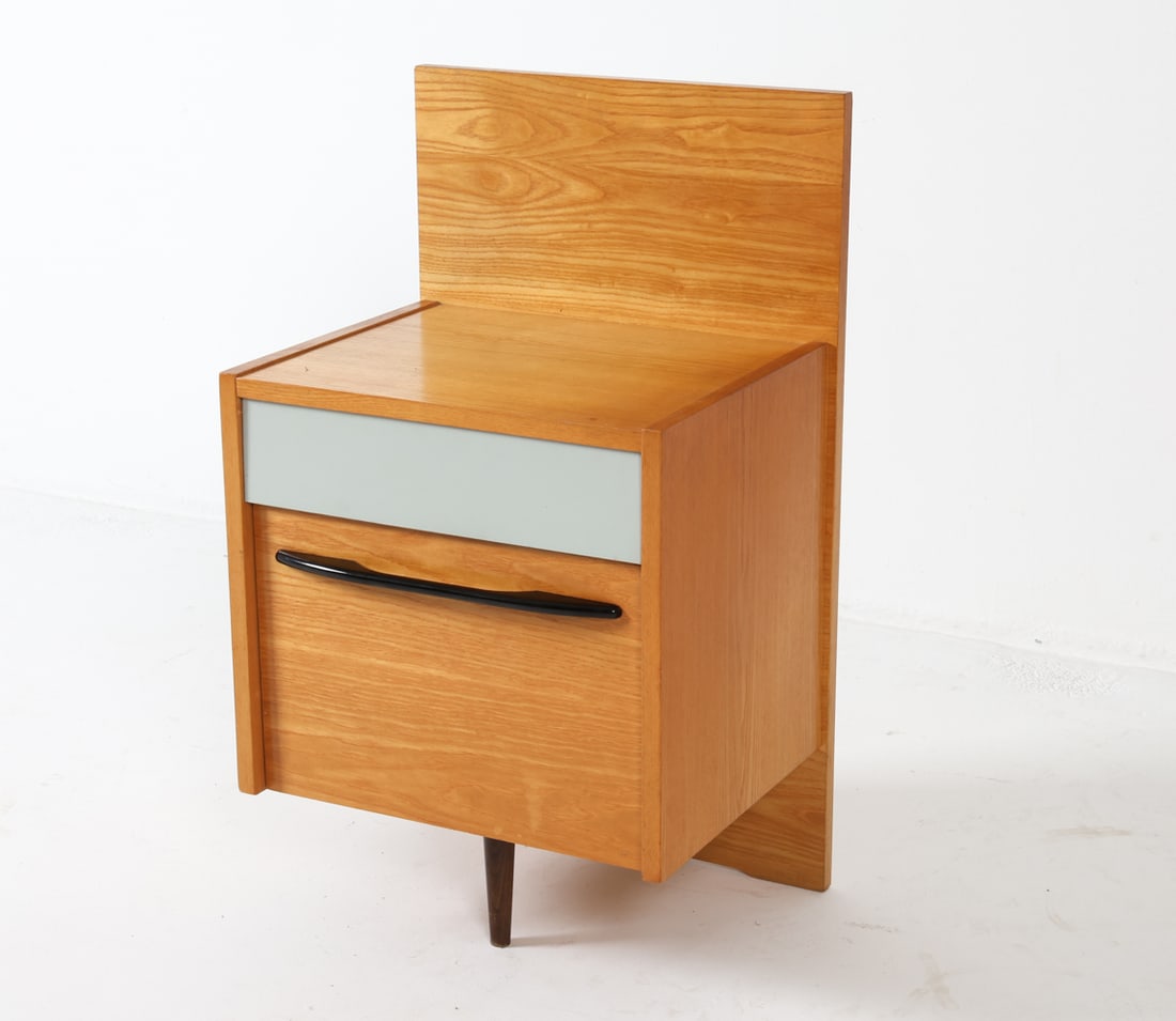 MOJMIR POZAR FOR ZAVODY OAK NIGHTSTAND C. 1960S: Czech Republic. Tag on back. Dimensions: H 31" x W 17.25" x D 14.75". Condition: Some sun fading to top, small spots of discoloration. Wear consistent with age and use. S025