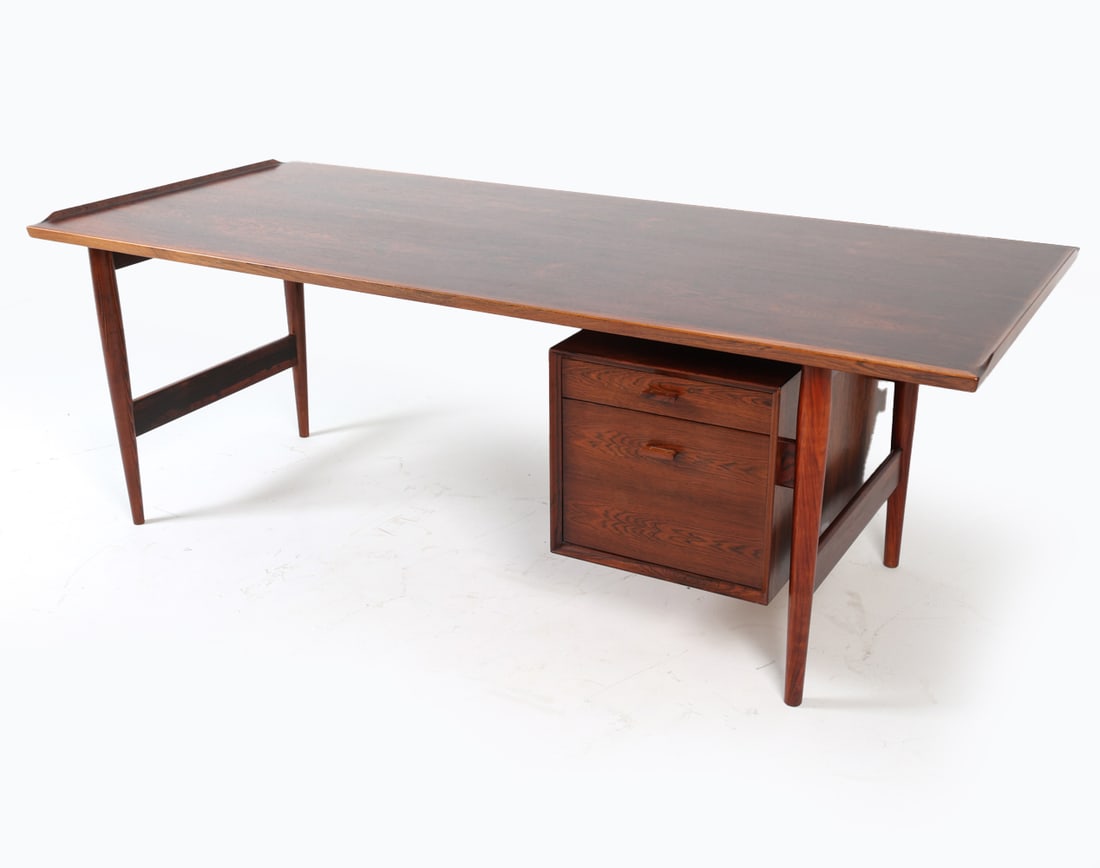 ARNE VODDER MODEL 207 DANISH ROSEWOOD DESK: For Sibast. Apparently unsigned. writing desk with one cabinet. Circa 1960s. Dimensions: H 28.5" x W 80.5" x D 35.5". Condition: No key included. Previous repair to one leg. possibly had another cabin