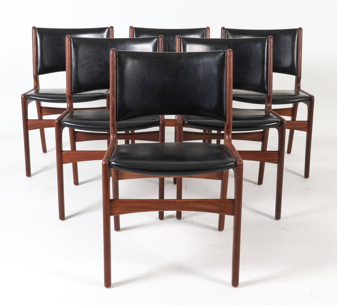 (6) ERIK BUCH MODEL 89 TEAK DINING CHAIRS: Teak frames with black leather upholstery. Denmark, circa 1960s. Dimensions: H 31.5" x W 19.25" x D 17.25" x SH 18". Condition: Split to one leg, pictured. Few scuffs and scratches to wood leather. We