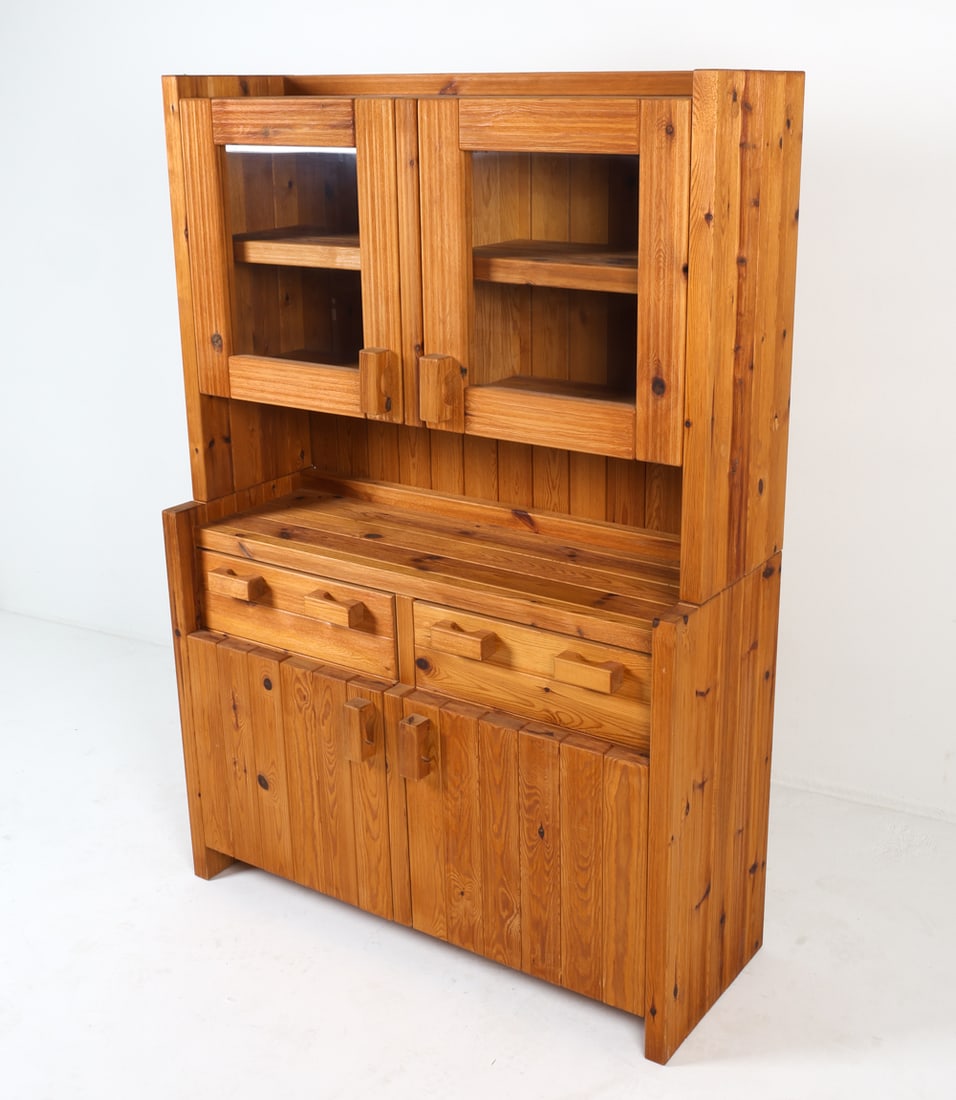 HANS FRYDENDAL "CHRISTIAN IV" PINE CABINET: Cabinet sits freely on base. Glass panels to top cabinet doors. Denmark, circa 1970s. Dimensions: As Displayed H 69.75" x W 48" x D 17.75". Base H 34.75", Top H 34.75". Condition: Minor scuffs and scr