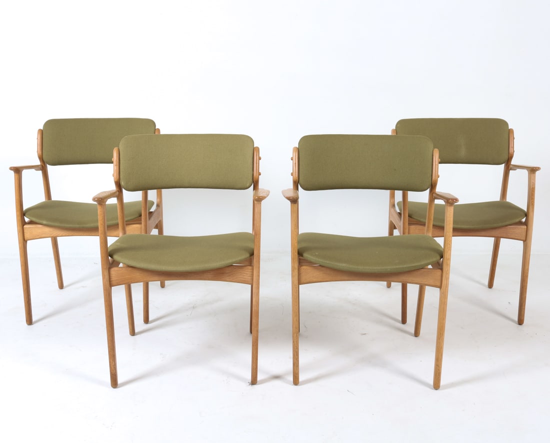 (4) ERIK BUCH MODEL 50 DANISH OAK DINING ARMCHAIRS: Danish label to underside. Without manufacturers label. Oak frames paired with green wool upholstery. Circa 1960s. Dimensions: H 31" x W 24" x D 18", SH 17" Condition: Armrests have minor rubbing. Pre