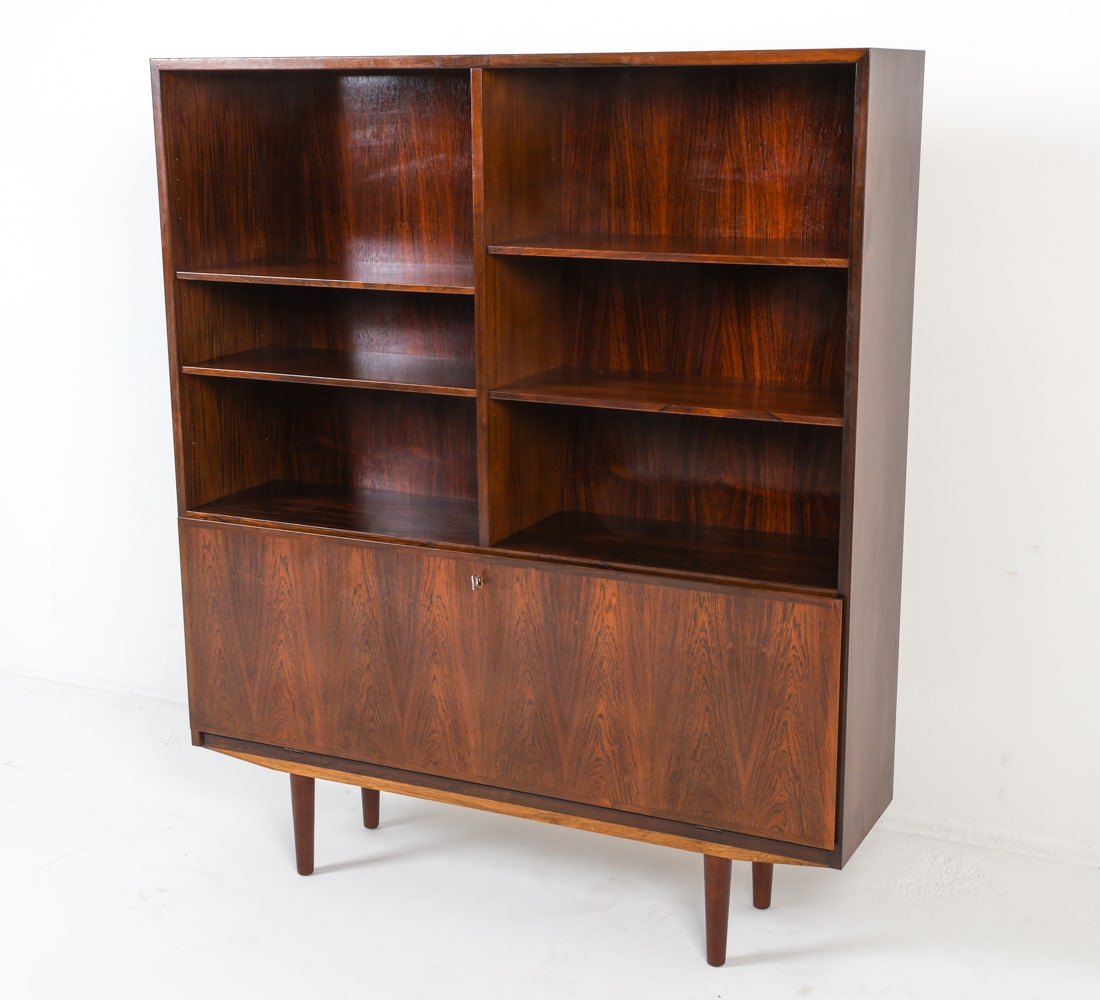 OMANN JUN MODEL 9 DANISH ROSEWOOD BOOKCASE: Key included. Labeled on back top corner. Adjustable shelves. Felted drawers inside cabinet. Dimensions: H 56" x W 47.5" x D 11.5". Condition: Light surface scratches. Good presentation overall. DMO06