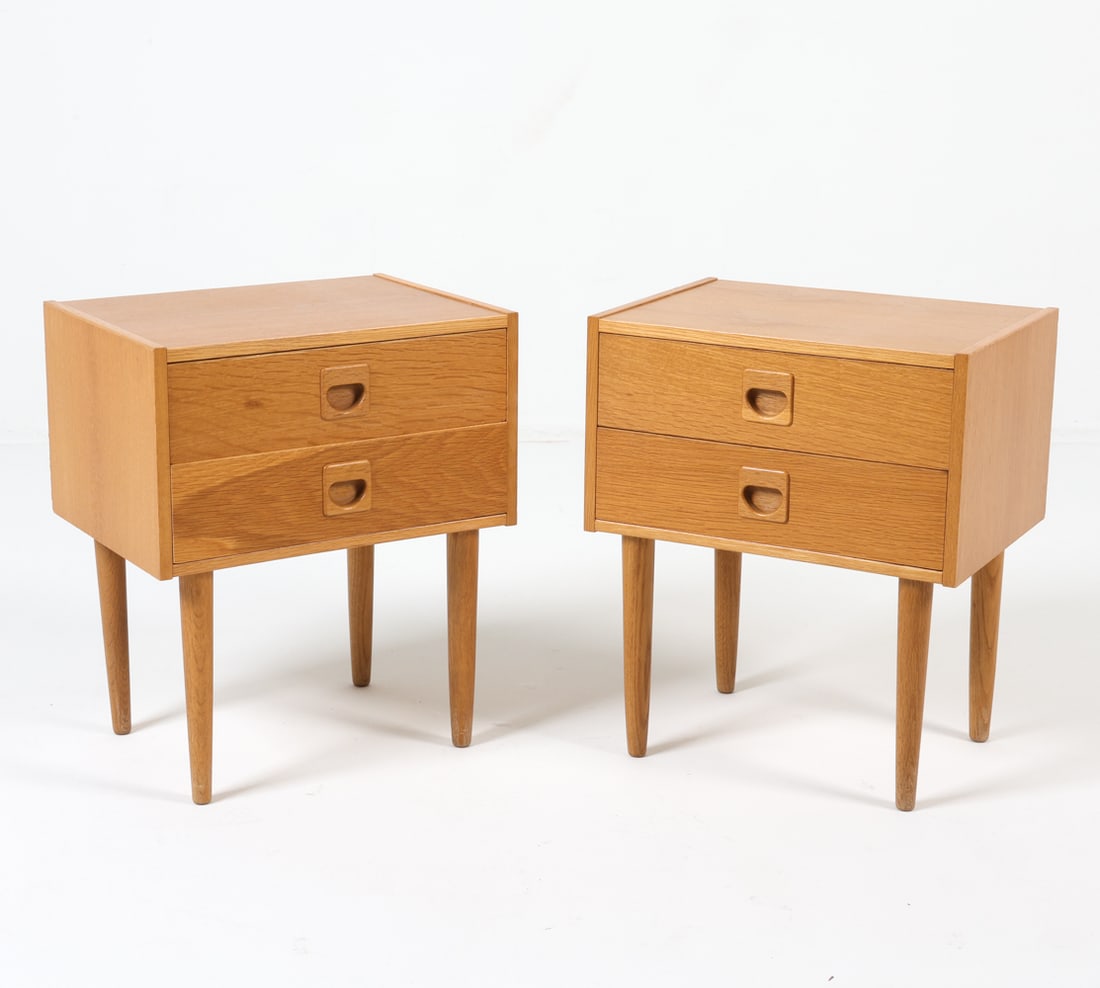 PAIR OF DANISH OAK NIGHTSTANDS C. 1960S: Stamped Made in Denmark to backside. Features molded drawer handles with an oak veneer. Dimensions: H 18" x W 15.25" x D 11.5" Condition: Minor nicks to veneer on edges. Presents well overall. DMO147