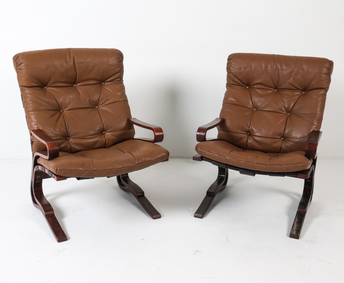 PAIR OF SCANDINAVIAN LEATHER LOUNGE CHAIRS C. 70S: In the style of Elsa & Nordahl Solheim 'Kengu' low back chairs for Rybo Rykken. Dimensions: H 36.75" x W 25.5" x D 26", SH 19" Condition: Discoloration to leather cushions. Tobacco scent. Slight rubbi