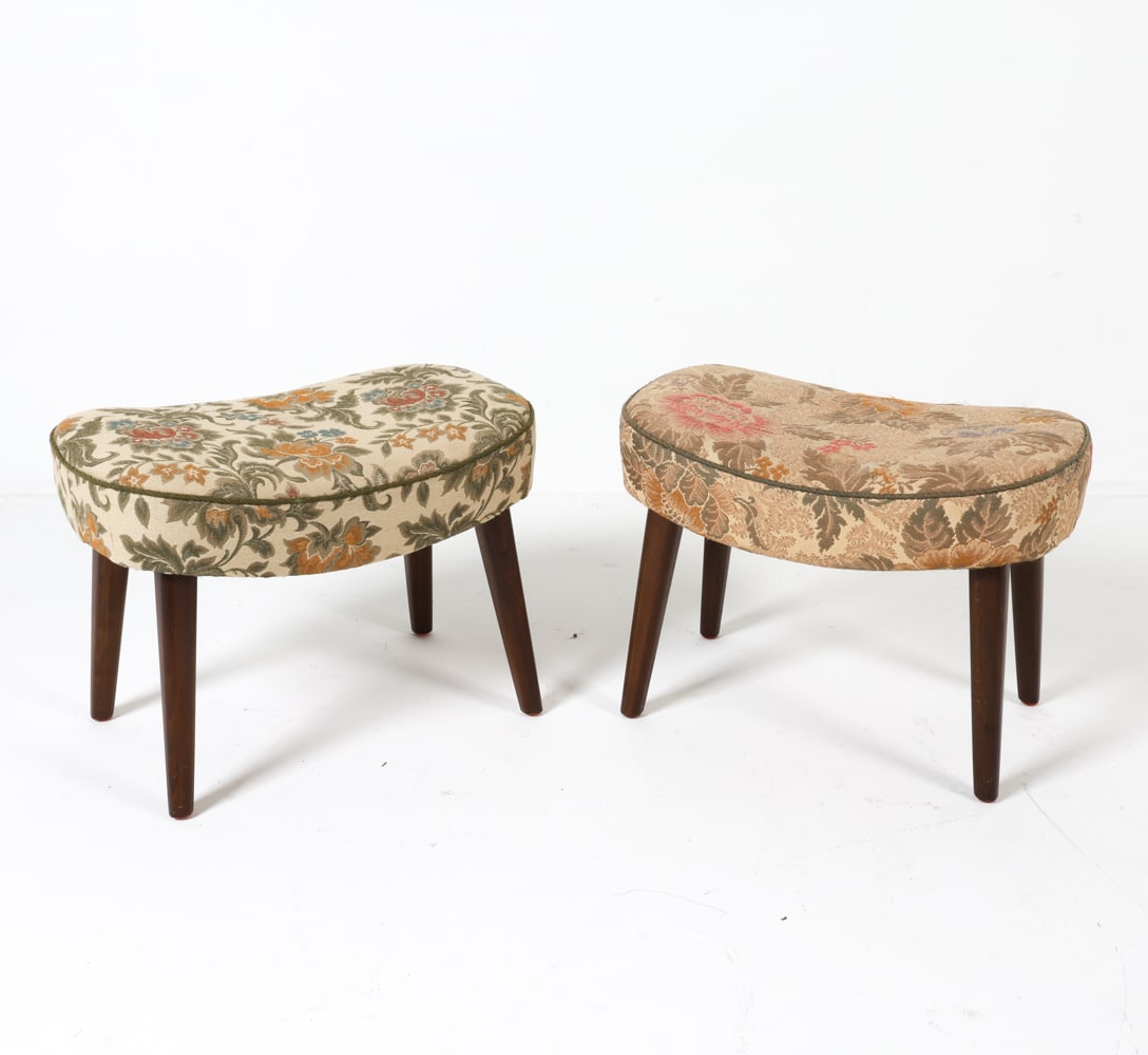 (2) MADSEN & SCHUBELL STYLE DANISH FOOTSTOOLS: Danish. Circa 1950s. Floral embroidered upholstery. In the manner of Madsen & Schubell. Dimensions: H 16.5" x W 23" x D 14" Condition: Upholstery has slight discoloration and minor fraying. Wear consi