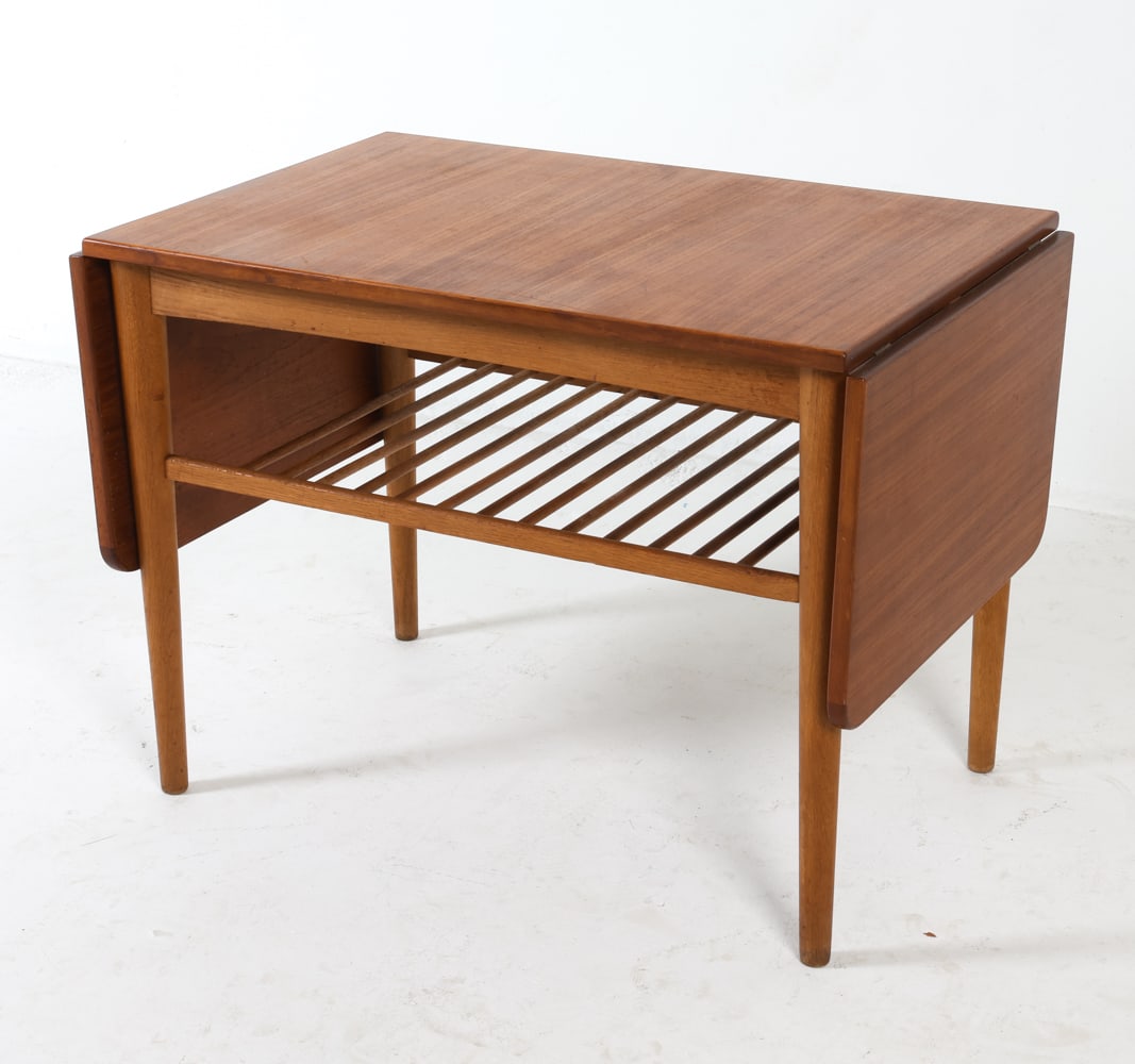 WENGER STYLE DANISH TEAK DROP LEAF COFFEE TABLE: Danish. Circa 1960s. Drop leaves on both side. Dimensions: H 22" x W 28.75" x D 19.75" Leaves: W 12.25" Condition: Light scratches and dings. Wear consistent with age and use. GCD162