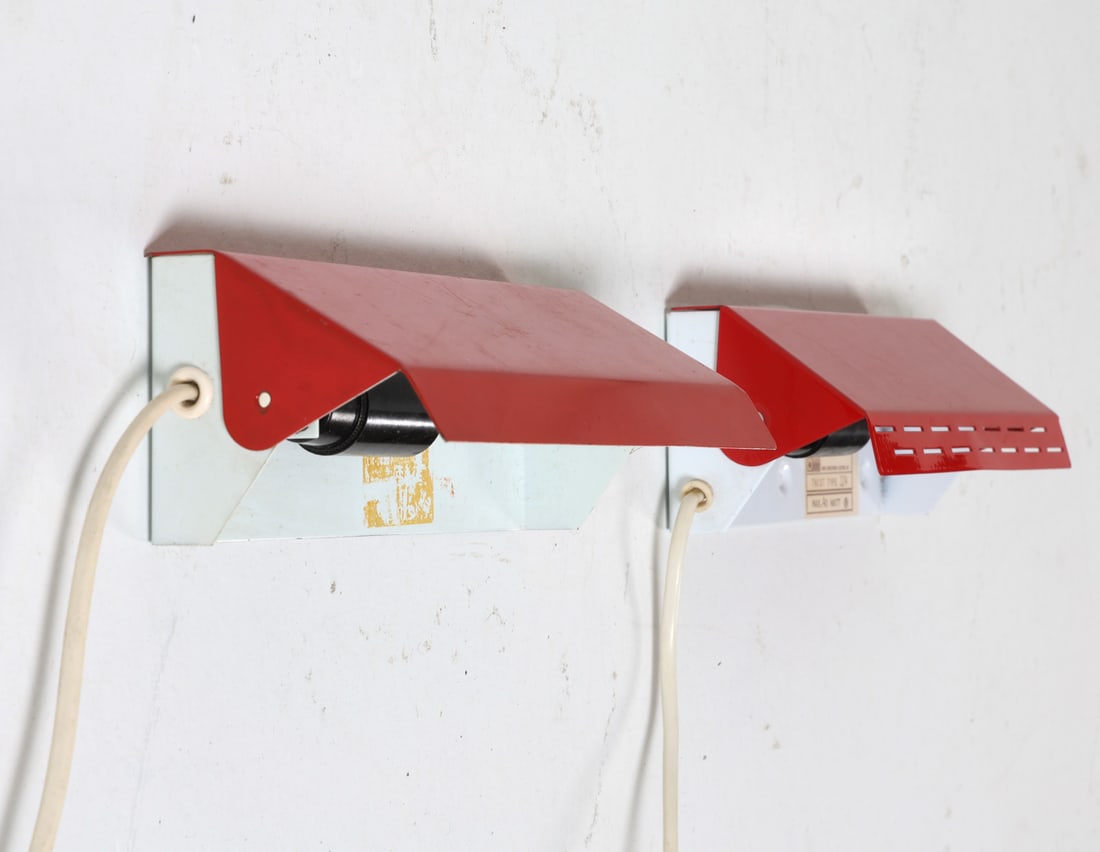 (2) KNUD CHRISTENSEN SCONCES C. 1970S: Denmark, circa 1970's. With rotating front panel. Twist Type 124. Dimensions: H 8" x W 3.25" x D 4". Condition: Light scattered scratches. Slight surface soiling. Cut wire, Untested. Wear consistent w