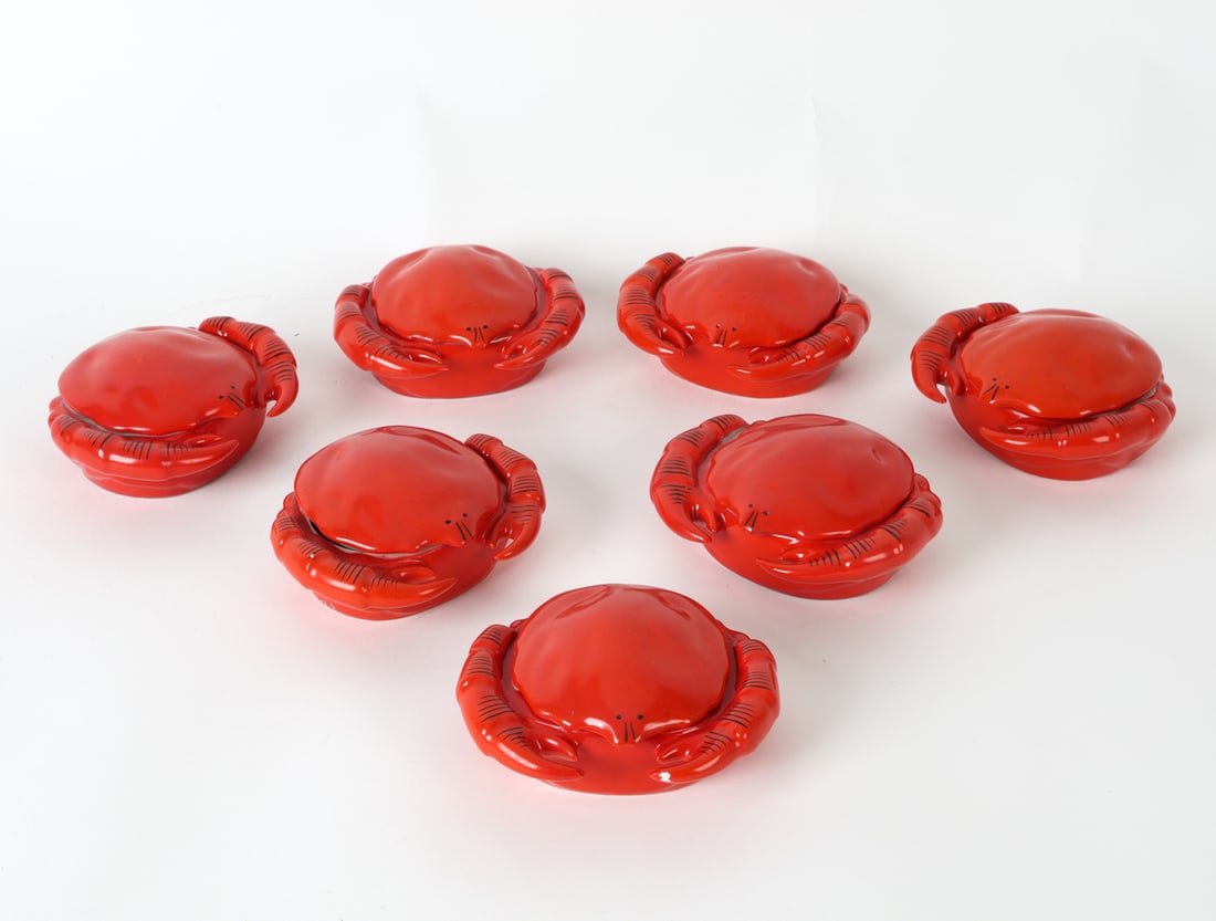 CZECH PORCELAIN CRAB BUTTER CUPS C. 1950S: Marked to undersides. 7 in total. Dimensions: H 2" x W 5" x D 4.5" Condition: Small chip to a claw on one cup. Slight scuffs and light scratches. Some rubbing to paint. Wear consistent with age and us