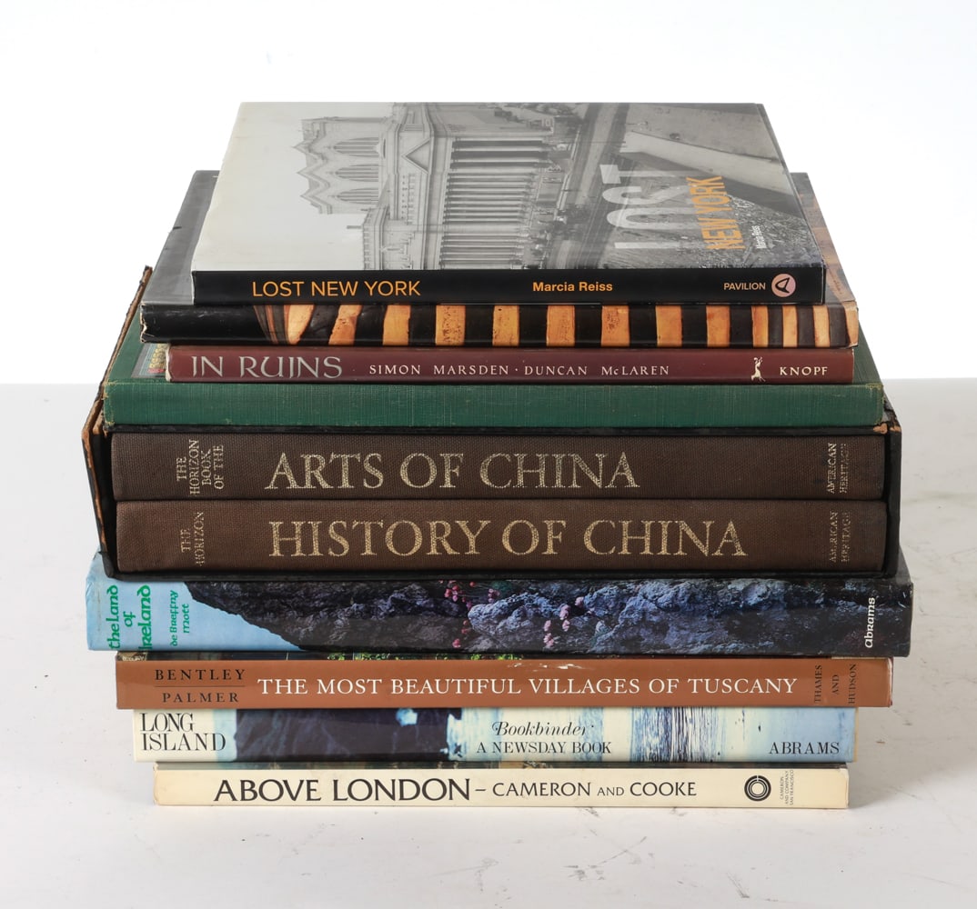 GROUPING OF TRAVEL COFFEE TABLE BOOKS: Including books about China, Ireland, Tuscany, London and more. Total of 11. Dimensions: H 11" x W 14" x D .75" Condition: Slight scuffs ,soiling and tear on China book sleeve. Minor scuffs on book sl