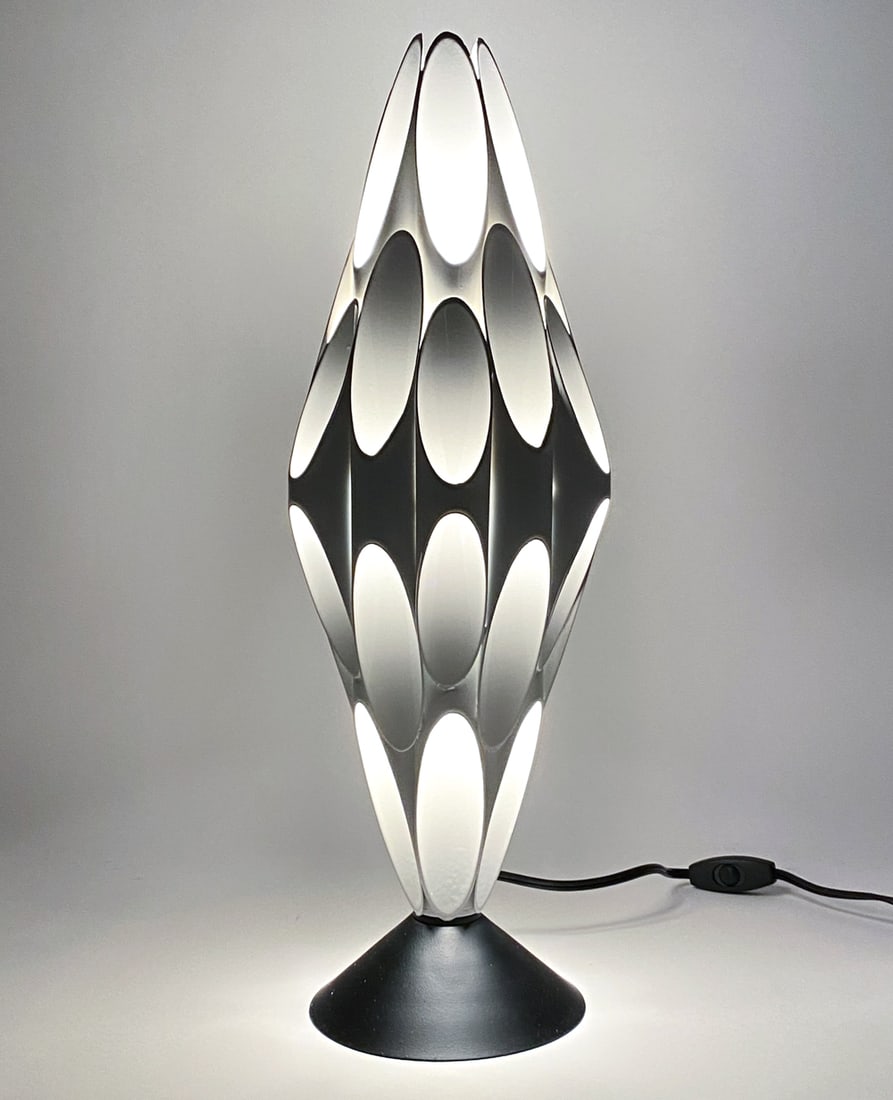 DESIGNLINE TUBULAR TABLE LAMP: Sculptural table lamp with white coated brass tubes. Made by Designline, after Rougier. Top removable to reveal bulb. Apparently unmarked. Dimensions: H 21" x Dia 7" Condition: Untested. Very minor ha