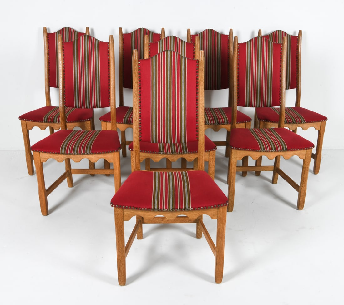 (8) HENNING KJAERNULF DANISH OAK DINING CHAIRS: For EG Mobler. Oak frames with patterned wool upholstery. Brass tacks accents. Denmark, circa 1970s. Dimensions: H 40.5" x W 19.25" x D 17.5" x SH 17.5". Condition: Few scuffs and dins to wood. Wear c