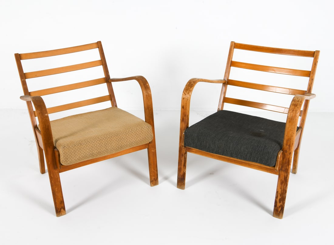 ATTR. PAIR FRITS SCHLEGEL ART DECO LOUNGE CHAIRS: Made for Fritz Hansen. Beech bentwood frames with ladder back construction. Denmark, circa 1940s. Dimensions: H 27" x W 24" x D 27" x SH 16". Condition: Evident losses and marks to finish throughout b